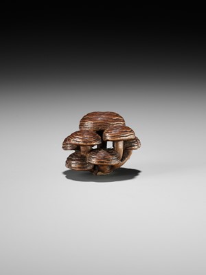 Lot 317 - A WOOD NETSUKE OF REISHI FUNGI