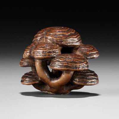 Lot 317 - A WOOD NETSUKE OF REISHI FUNGI