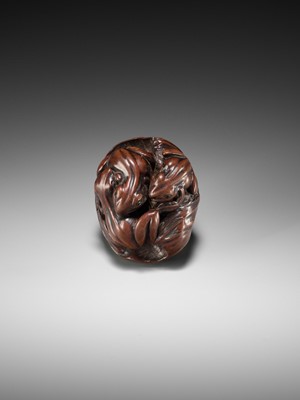 Lot 205 - ISSAN: A FINE WOOD NETSUKE OF SUMO WRESTLING FROGS ON A LOTUS LEAF