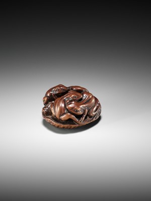 Lot 205 - ISSAN: A FINE WOOD NETSUKE OF SUMO WRESTLING FROGS ON A LOTUS LEAF