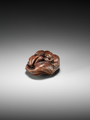 Lot 205 - ISSAN: A FINE WOOD NETSUKE OF SUMO WRESTLING FROGS ON A LOTUS LEAF