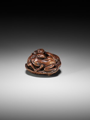 Lot 205 - ISSAN: A FINE WOOD NETSUKE OF SUMO WRESTLING FROGS ON A LOTUS LEAF