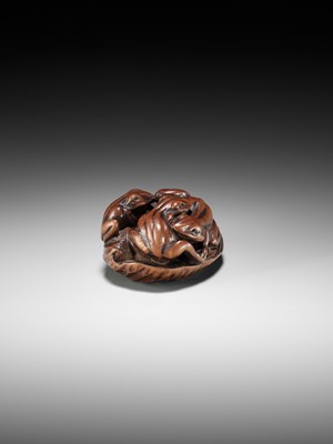 Lot 205 - ISSAN: A FINE WOOD NETSUKE OF SUMO WRESTLING FROGS ON A LOTUS LEAF