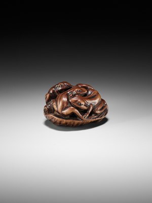 Lot 205 - ISSAN: A FINE WOOD NETSUKE OF SUMO WRESTLING FROGS ON A LOTUS LEAF