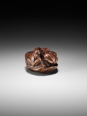 Lot 205 - ISSAN: A FINE WOOD NETSUKE OF SUMO WRESTLING FROGS ON A LOTUS LEAF