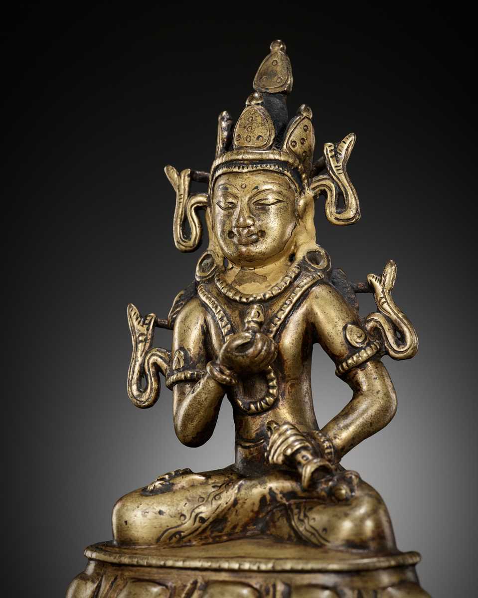 Lot 649 - A GILT-BRONZE AND TURQUOISE-INLAID FIGURE OF VAJRASATTVA, KASHMIR STYLE, WEST TIBET, 12TH CENTURY