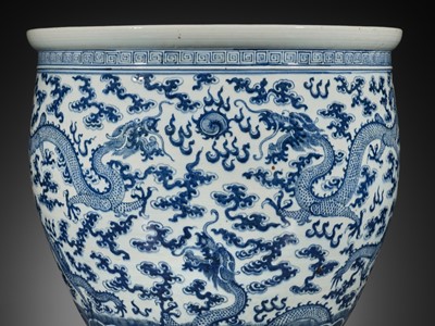 Lot 158 - A LARGE BLUE AND WHITE ‘NINE DRAGON’ JARDINIÈRE, QING DYNASTY