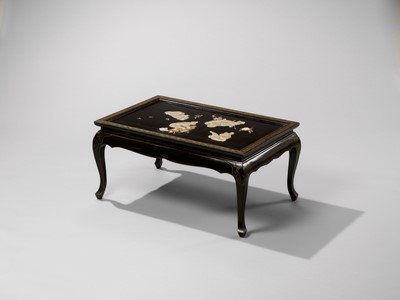Lot 19 - A FINE ANTLER AND MOTHER-OF-PEARL INLAID BLACK-LACQUER LOW TABLE WITH FROLICKING MONKEYS