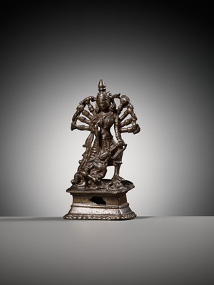 Lot 204 - A SMALL BRONZE FIGURE OF DURGA SLAYING THE BUFFALO-DEMON MAHISHA, INDIA, 16TH-17TH CENTURY