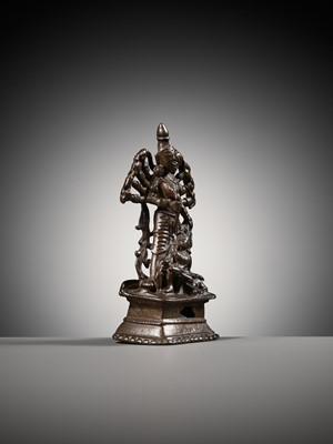 Lot 204 - A SMALL BRONZE FIGURE OF DURGA SLAYING THE BUFFALO-DEMON MAHISHA, INDIA, 16TH-17TH CENTURY