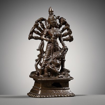 Lot 204 - A SMALL BRONZE FIGURE OF DURGA SLAYING THE BUFFALO-DEMON MAHISHA, INDIA, 16TH-17TH CENTURY