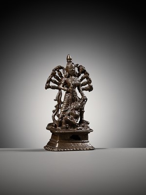 Lot 204 - A SMALL BRONZE FIGURE OF DURGA SLAYING THE BUFFALO-DEMON MAHISHA, INDIA, 16TH-17TH CENTURY