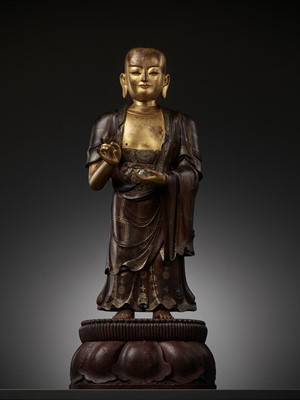 Lot 187 - A LARGE AND HIGHLY IMPORTANT ZITAN AND GILT-LACQUERED STATUE OF SARIPUTRA, THE FIRST OF BUDDHA'S TWO CHIEF DISCIPLES, CHINA, 1520-1580