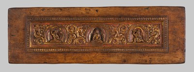 Lot 4 - A GILT AND PAINTED WOOD MANUSCRIPT COVER DEPICTING A BUDDHIST TRIAD, TIBET, 12TH-13TH CENTURY