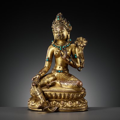 Lot 335 - A GILT AND TURQUOISE-INLAID COPPER ALLOY FIGURE OF GREEN TARA, DENSATIL STYLE, TIBET, 14TH CENTURY