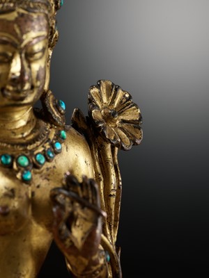 Lot 2 - A GILT AND TURQUOISE-INLAID COPPER ALLOY FIGURE OF GREEN TARA, DENSATIL STYLE, TIBET, 14TH CENTURY