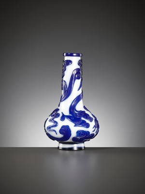 Lot 23 - A SAPPHIRE-BLUE OVERLAY GLASS ‘CHILONG’ BOTTLE VASE, QIANLONG MARK AND POSSIBLY OF THE PERIOD