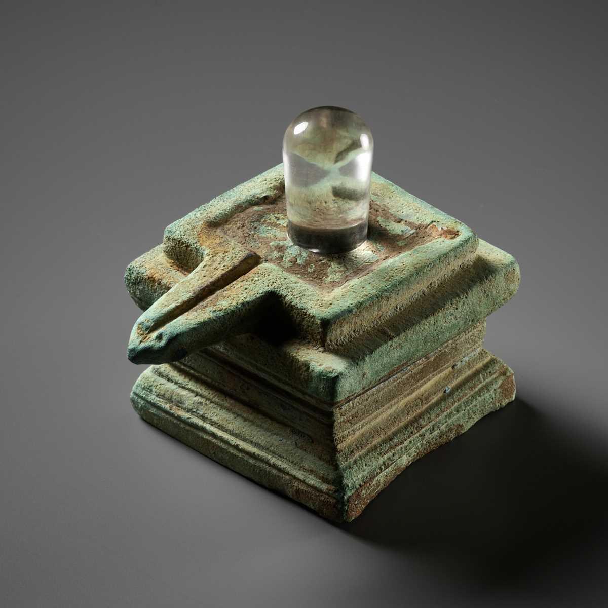 Lot 358 - A ROCK CRYSTAL LINGA AND BRONZE YONI, ANGKOR PERIOD