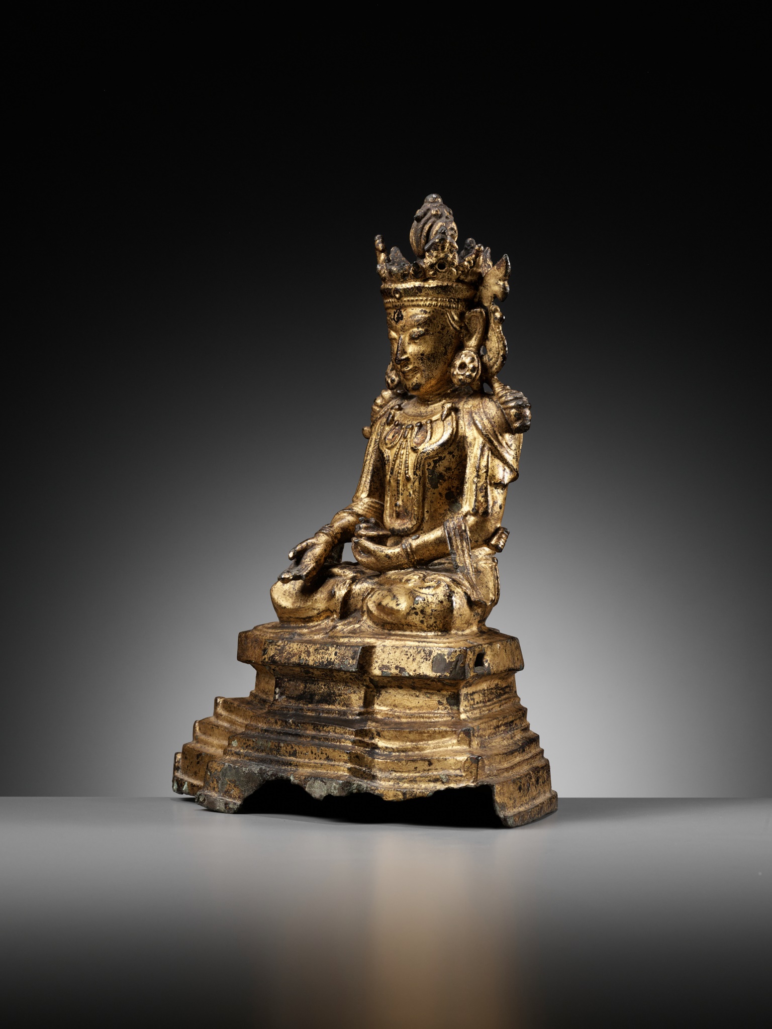 Lot 693 AN ARAKAN STYLE GILT BRONZE FIGURE OF BUDDHA