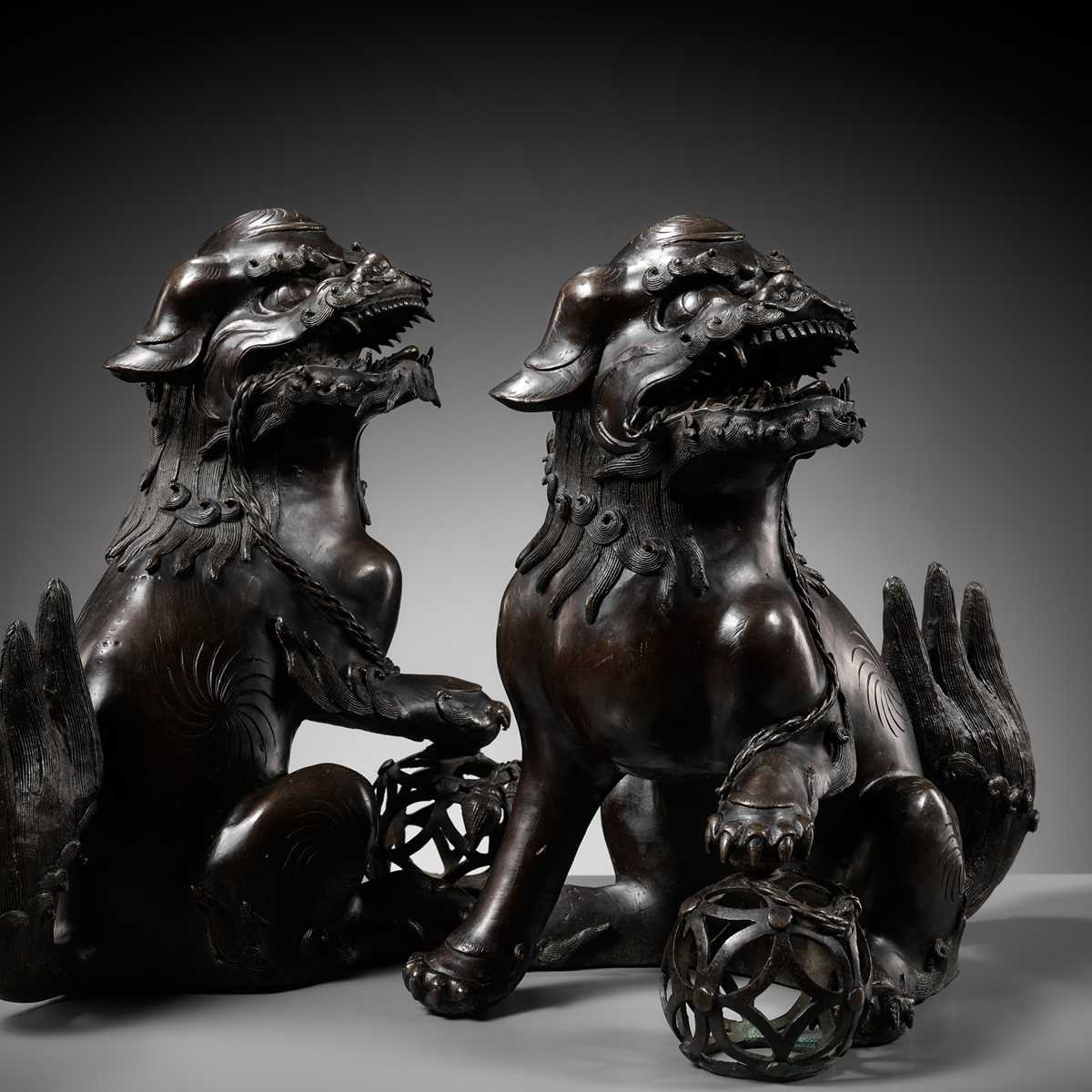 Lot 79 - A PAIR OF LARGE BRONZE ‘BUDDHIST LION’ CENSERS, 17TH CENTURY