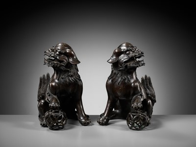 Lot 79 - A PAIR OF LARGE BRONZE ‘BUDDHIST LION’ CENSERS, 17TH CENTURY