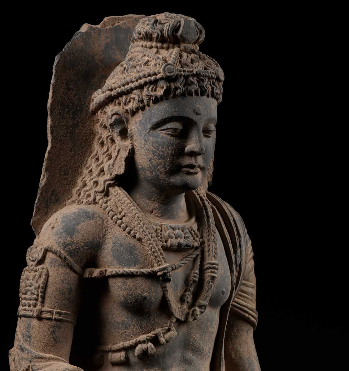 Lot 1251 - A MONUMENTAL GRAY SCHIST FIGURE OF MAITREYA