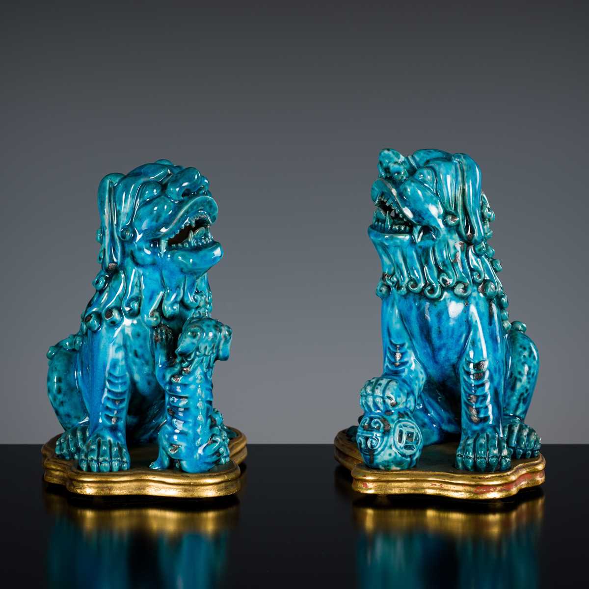 Lot 492 - A PAIR OF TURQUOISE-GLAZED FIGURES OF BUDDHIST LIONS, KANGXI PERIOD