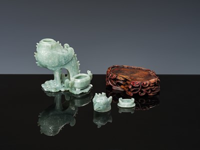 Lot 351 - AN ARCHAISTIC JADEITE ‘MYTHICAL BIRD’ GROUP OF TWO VESSELS AND COVERS, LATE QING DYNASTY TO REPUBLIC PERIOD