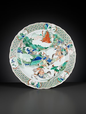 Lot 95 - A LARGE AND BARBED FAMILLE VERTE ‘WARRIOR’ DISH, KANGXI PERIOD