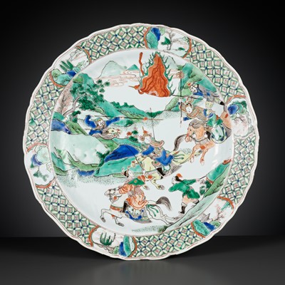 Lot 95 - A LARGE AND BARBED FAMILLE VERTE ‘WARRIOR’ DISH, KANGXI PERIOD