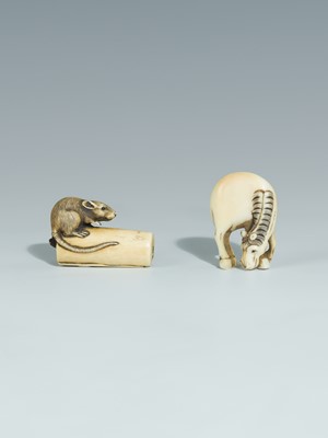 Lot 394 - TWO IVORY NETSUKE DEPICTING A GRAZING HORSE AND A RAT ON A CANDLE