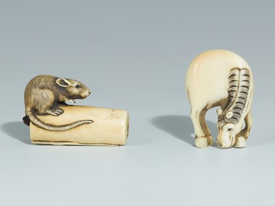 Lot 394 - TWO IVORY NETSUKE DEPICTING A GRAZING HORSE AND A RAT ON A CANDLE