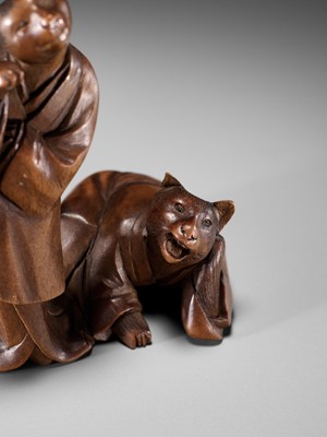 Lot 154 - A RARE WOOD NETSUKE-OKIMONO OF A CAT GEISHA AND CLIENT