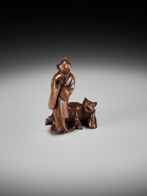 Lot 154 - A RARE WOOD NETSUKE-OKIMONO OF A CAT GEISHA AND CLIENT