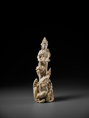 Lot 146 - RYUMIN: AN IMPRESSIVE TOKYO SCHOOL IVORY OKIMONO OF SHO-KANNON WITH DRAGON
