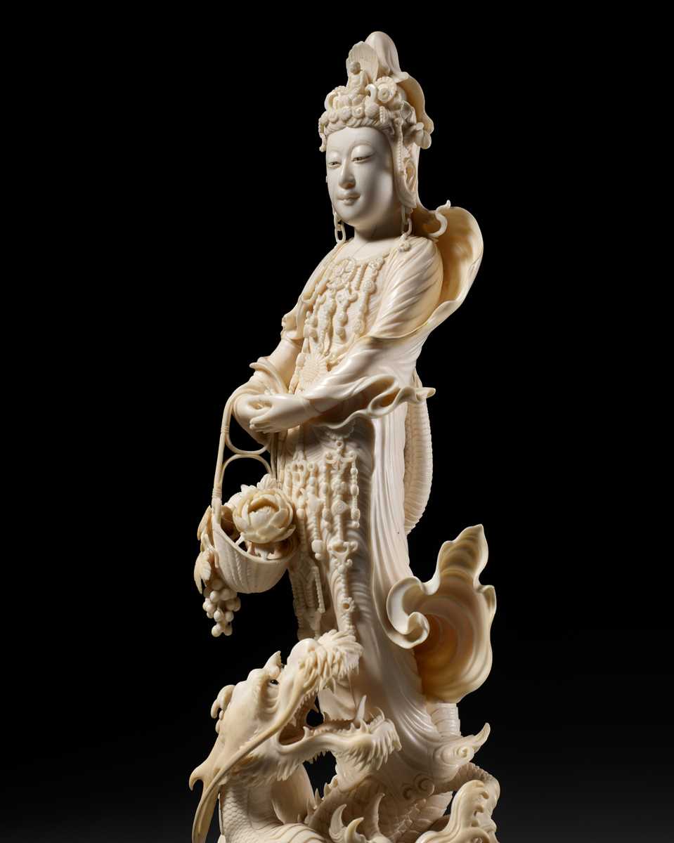 Lot 146 - RYUMIN: AN IMPRESSIVE TOKYO SCHOOL IVORY OKIMONO OF SHO-KANNON WITH DRAGON