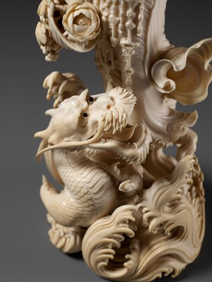 Lot 146 - RYUMIN: AN IMPRESSIVE TOKYO SCHOOL IVORY OKIMONO OF SHO-KANNON WITH DRAGON