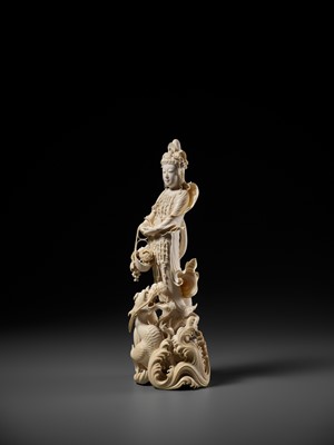 Lot 146 - RYUMIN: AN IMPRESSIVE TOKYO SCHOOL IVORY OKIMONO OF SHO-KANNON WITH DRAGON