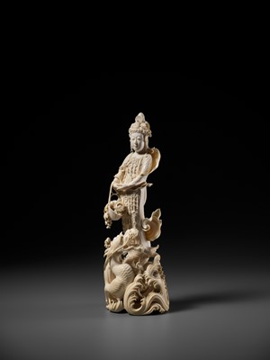 Lot 146 - RYUMIN: AN IMPRESSIVE TOKYO SCHOOL IVORY OKIMONO OF SHO-KANNON WITH DRAGON