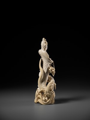 Lot 146 - RYUMIN: AN IMPRESSIVE TOKYO SCHOOL IVORY OKIMONO OF SHO-KANNON WITH DRAGON
