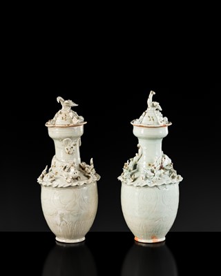 Lot 147 - A PAIR OF QINGBAI FUNERARY JARS AND COVERS WITH THE 'GREEN DRAGON' OF THE EAST AND THE 'WHITE TIGER' OF THE WEST, SONG DYNASTY