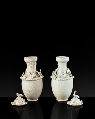 Lot 147 - A PAIR OF QINGBAI FUNERARY JARS AND COVERS WITH THE 'GREEN DRAGON' OF THE EAST AND THE 'WHITE TIGER' OF THE WEST, SONG DYNASTY