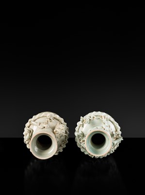 Lot 147 - A PAIR OF QINGBAI FUNERARY JARS AND COVERS WITH THE 'GREEN DRAGON' OF THE EAST AND THE 'WHITE TIGER' OF THE WEST, SONG DYNASTY