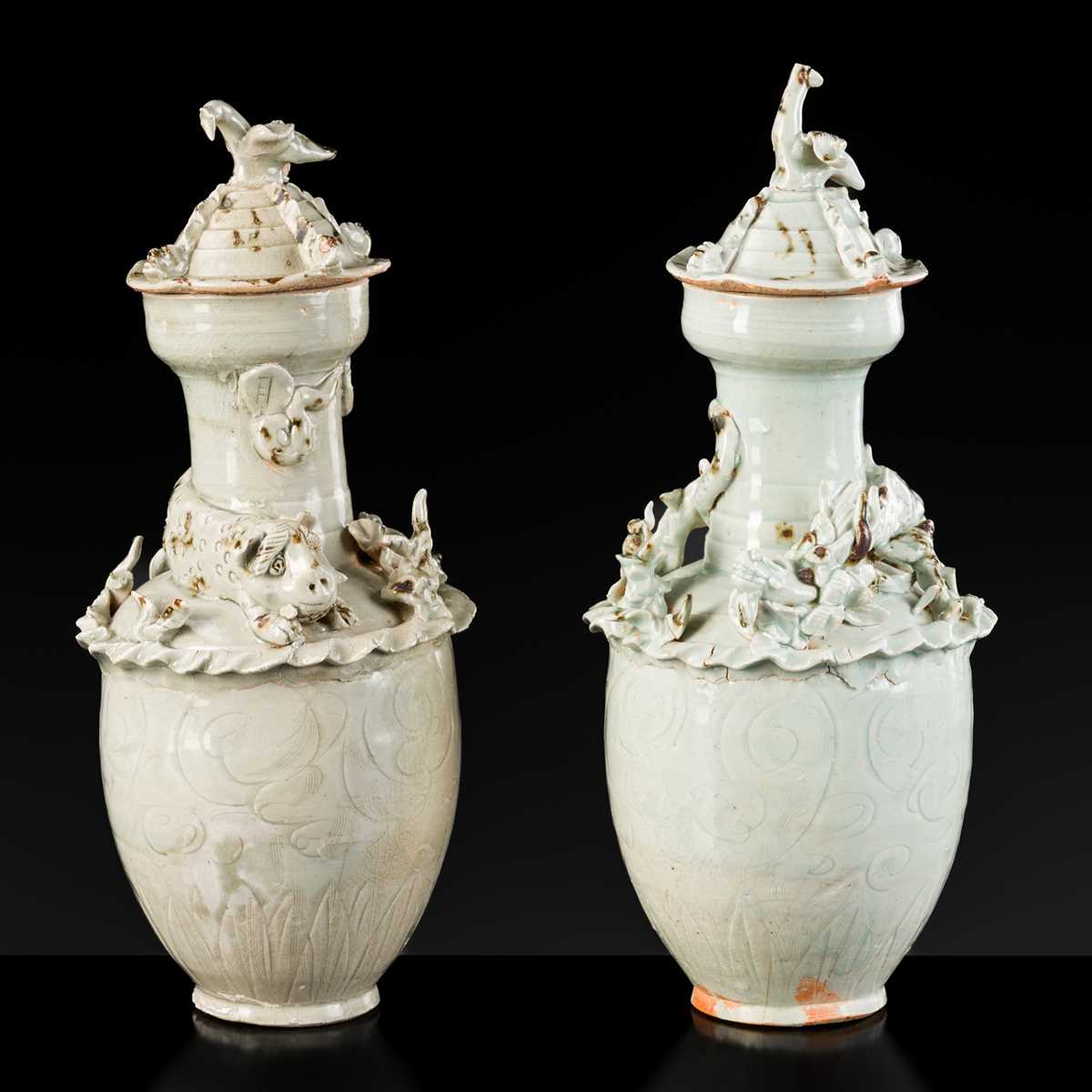 Lot 147 - A PAIR OF QINGBAI FUNERARY JARS AND COVERS WITH THE 'GREEN DRAGON' OF THE EAST AND THE 'WHITE TIGER' OF THE WEST, SONG DYNASTY