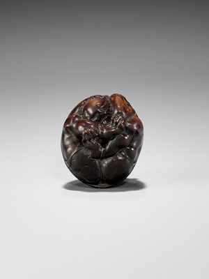 Lot 220 - MASAKAZU: A NAGOYA SCHOOL WOOD NETSUKE OF A COWERING ONI DURING SETSUBUN