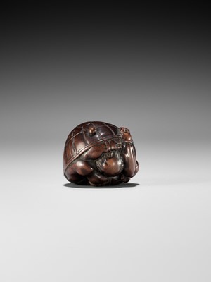 Lot 220 - MASAKAZU: A NAGOYA SCHOOL WOOD NETSUKE OF A COWERING ONI DURING SETSUBUN