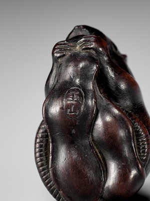 Lot 338 - GYOKUZAN: A FINE WOOD NETSUKE OF A RAT WITH EDAMAME BEAN PODS