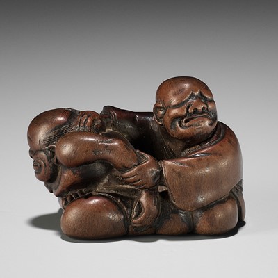 Lot 405 - A SUPERB WOOD NETSUKE OF A BLIND MASSEUR AND CLIENT, ATTRIBUTED TO JOBUN