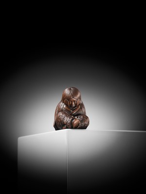 Lot 610 - TADATOSHI: A SUPERB NAGOYA SCHOOL WOOD NETSUKE OF A SLEEPING SHOJO