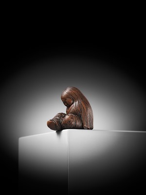 Lot 610 - TADATOSHI: A SUPERB NAGOYA SCHOOL WOOD NETSUKE OF A SLEEPING SHOJO